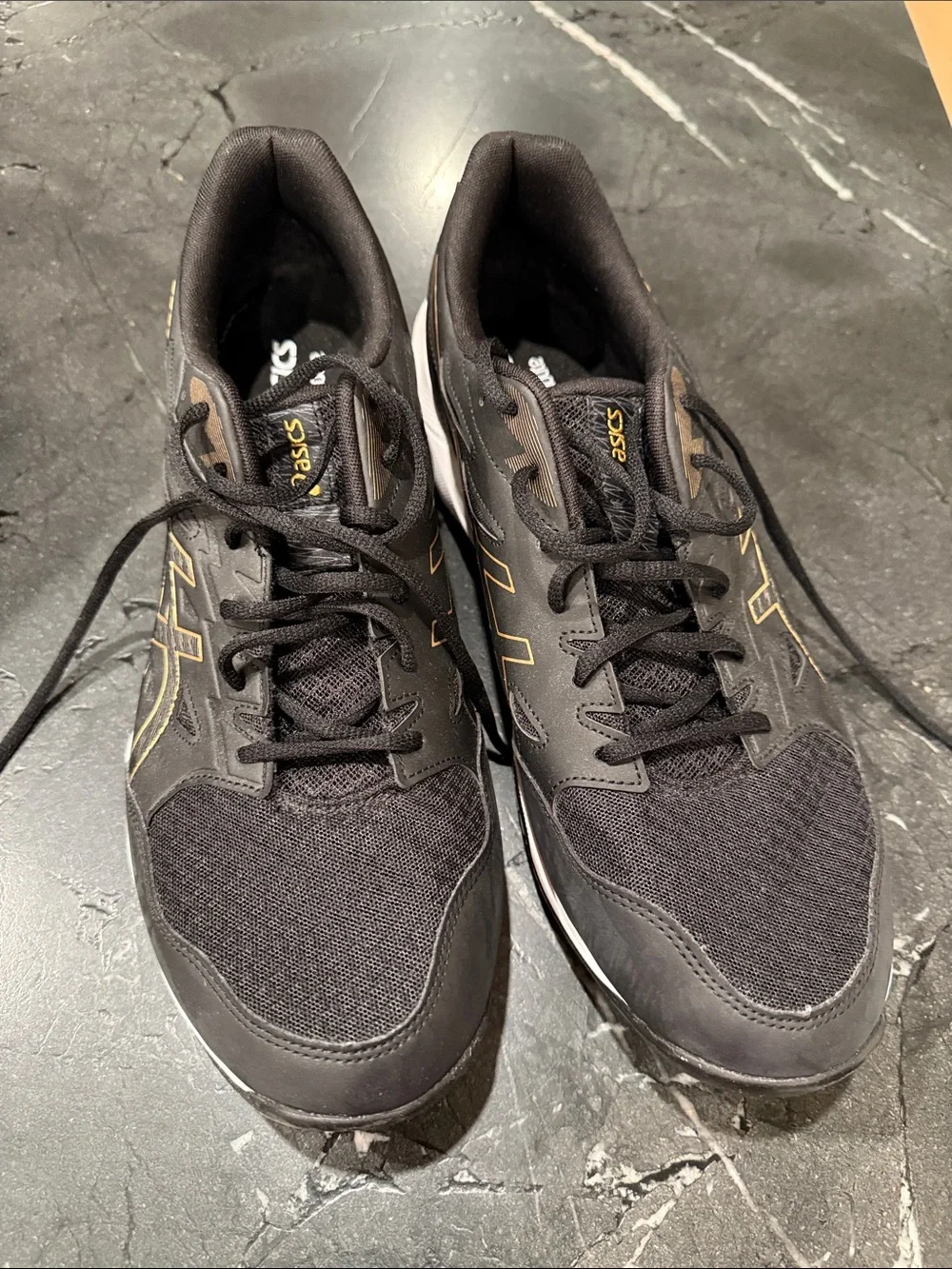 Asics Black Athletic Sneakers with Gold Detailing